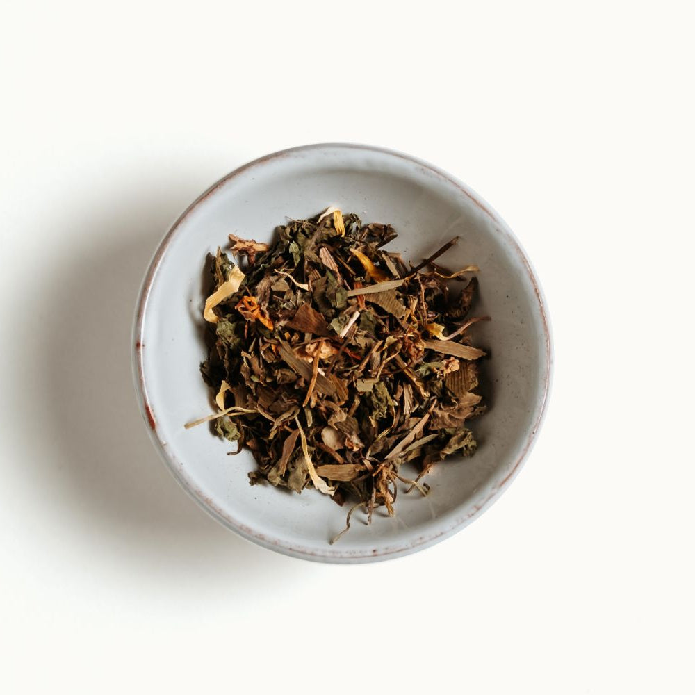 
                  
                    White bowl with focus tea blend on a white background
                  
                